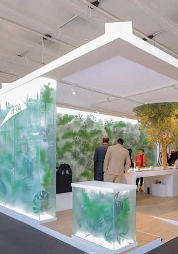 The RTA COP28 stand by Studio Königshausen in Dubai boasts an avant-garde design, featuring illuminated walls adorned with lush greenery, shaping an interactive, futuristic city model.